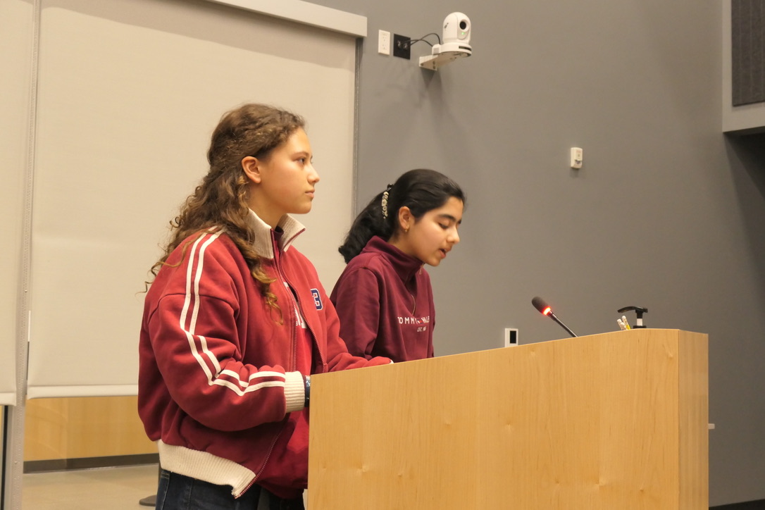 Chloe and Suhani proposing board policy at a Fremont Union High School District board meeting.