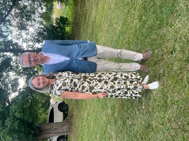 Susan and David Tunnell standing together in a garden.